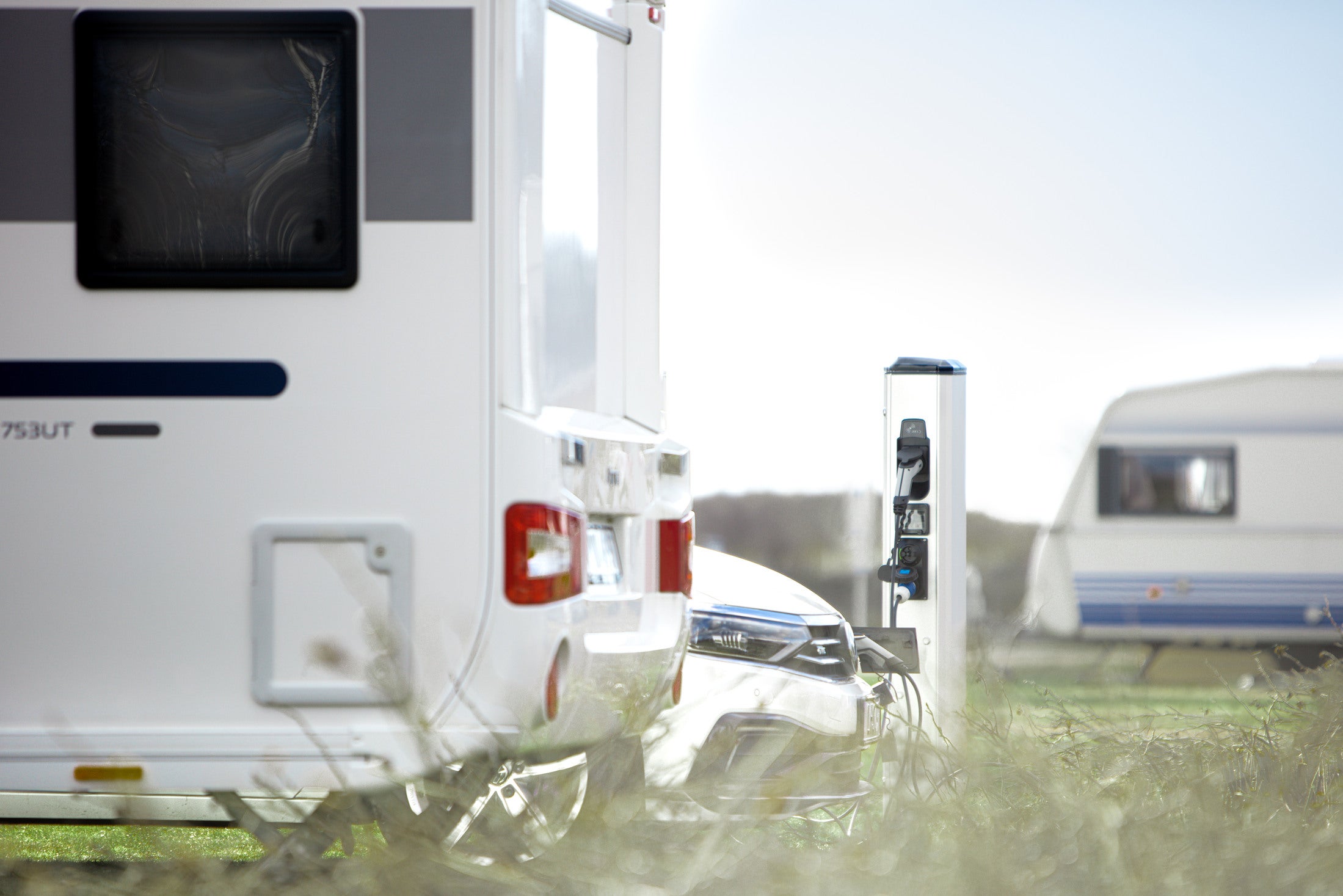 GARO is launching the first post with power outlets for both electric vehicle charging and camping needs.